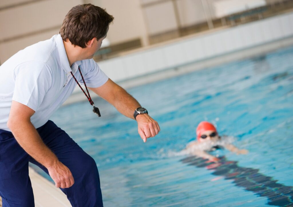 recognized swimmer being trained by his coach