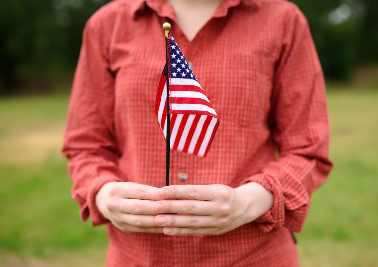 U.S. citizen holding the country flag