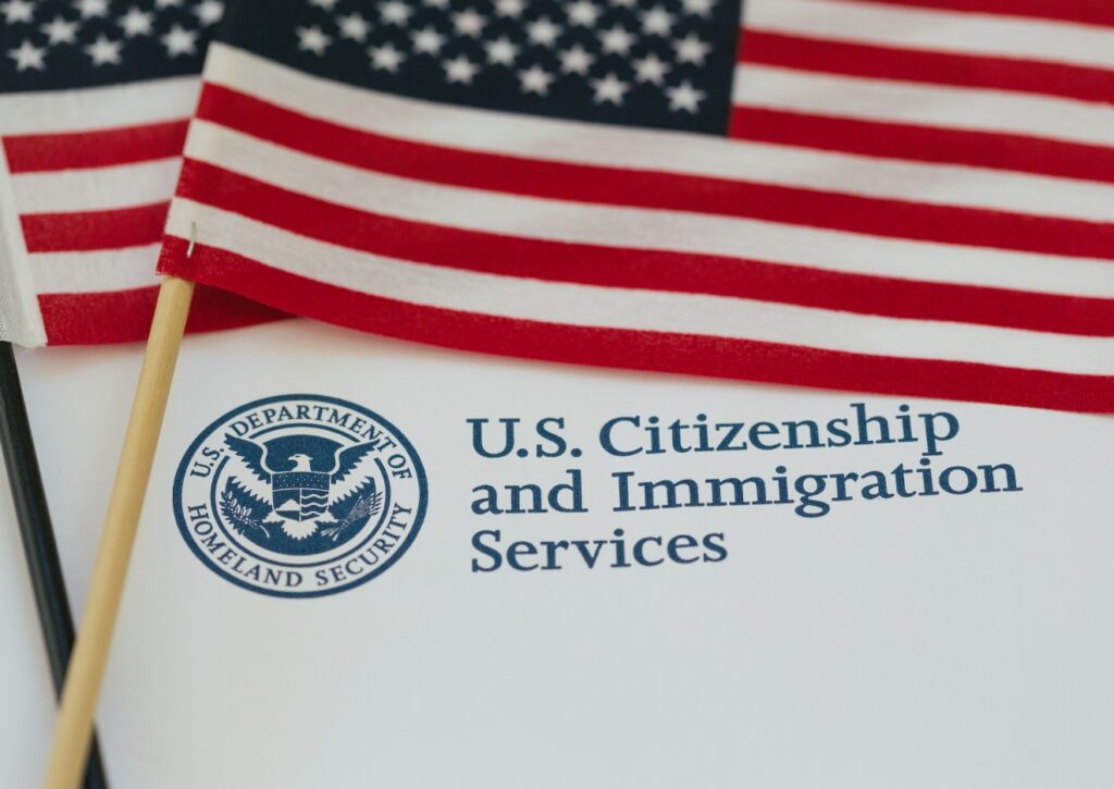 USCIS Letterhead and two flags on top